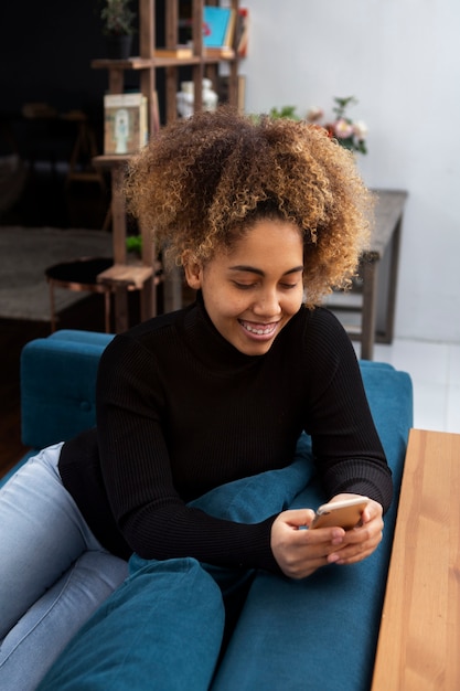 Medium shot woman addicted to smartphone