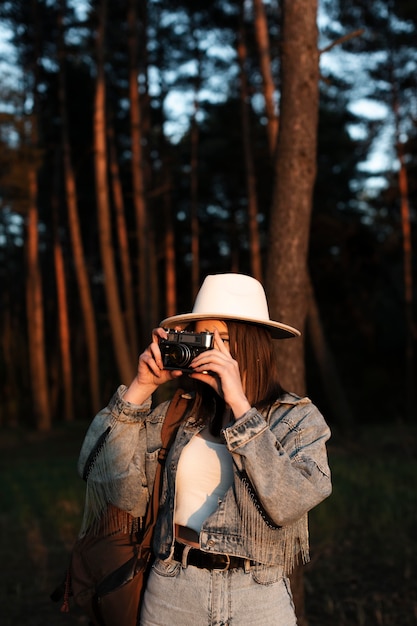 Free photo medium shot woman taking photos