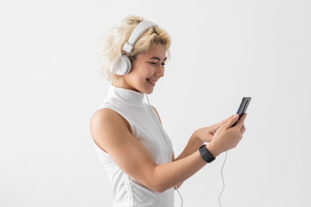 Medium shot woman with headphones