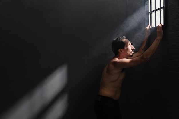 Free Photo middle aged man spending time in jail