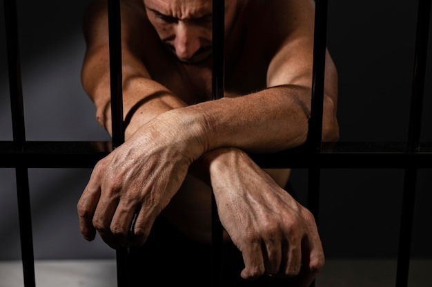 Free Photo middle aged man spending time in jail