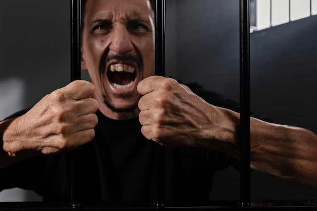 Free Photo middle aged man spending time in jail