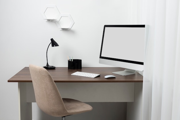 Free Photo minimalist desk arrangement with lamp