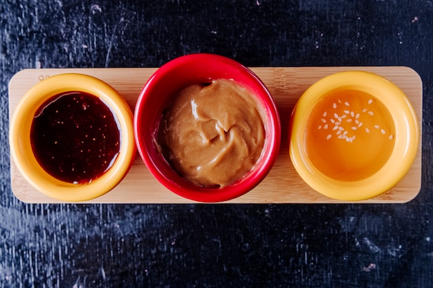 Free Photo mix sauces strawberry jam condensed milk honey top view