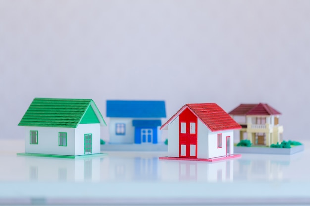 Free photo model of house painted white under the tiled roof