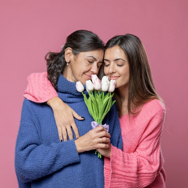 Free photo mother with flowers from daughter