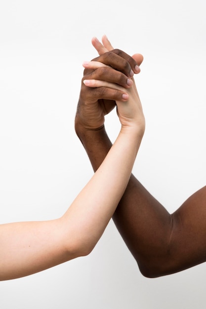 Free photo multiracial hands coming together