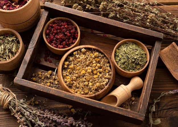 Free photo natural various herbs in a wooden box high view