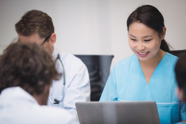 Free Photo nurse using laptop in conference room