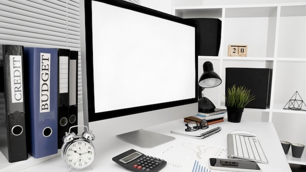 Free Photo office workspace with computer screen and lamp