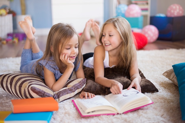 Free photo one book and two girls