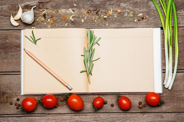 Free Photo open blank recipe book on brown wooden background