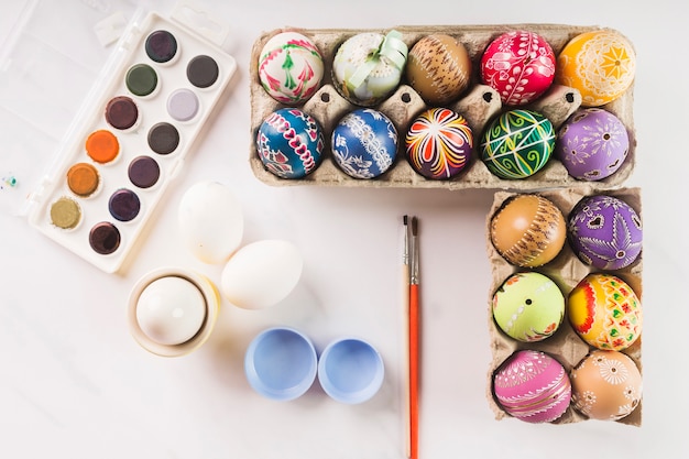 Free Photo paints near lovely easter eggs