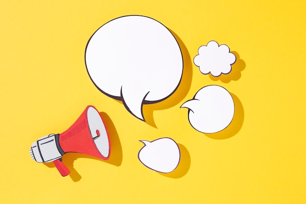 Free Photo paper style megaphone and speech bubbles