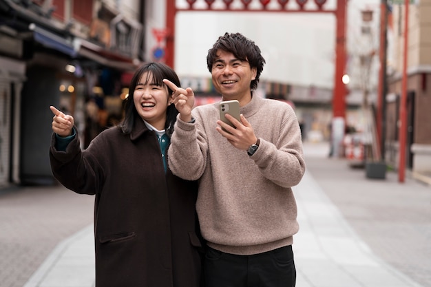 Free photo people enjoying japanese street food