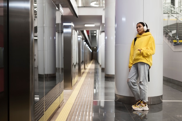 Free photo people traveling on the subway in winter time