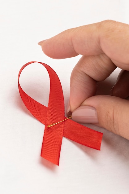 Person holding an world aids day ribbon