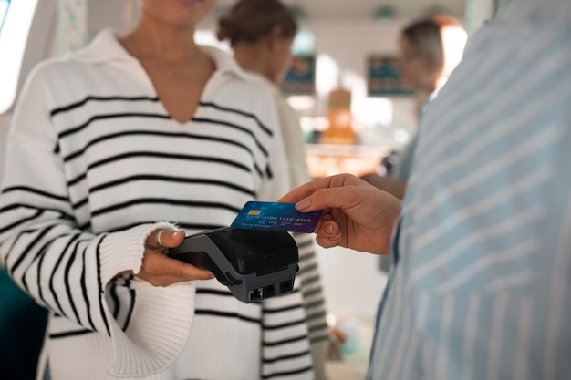 Free photo person paying with nfc technology at a restaurant