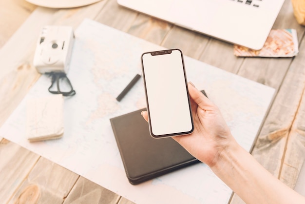 Free photo a person showing blank screen display on smartphone