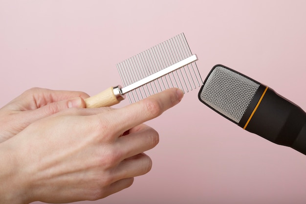 Free Photo person using comb close to microphone for asmr