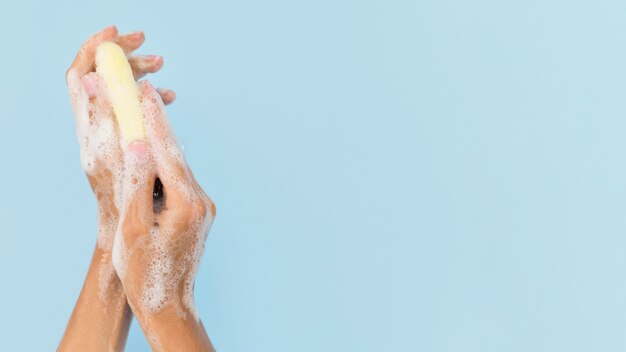 Person washing hands with soap