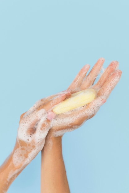 Person washing hands with soap