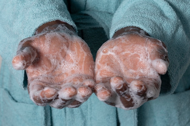 Person washing hands with soap