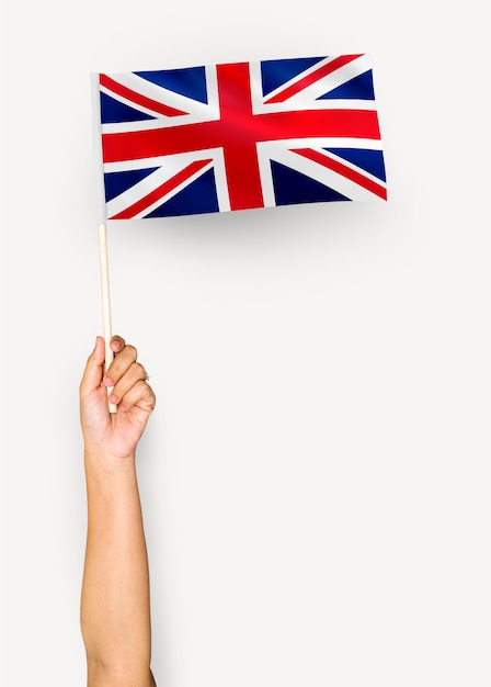 Free photo person waving the flag of united kingdom of great britain and northern ireland