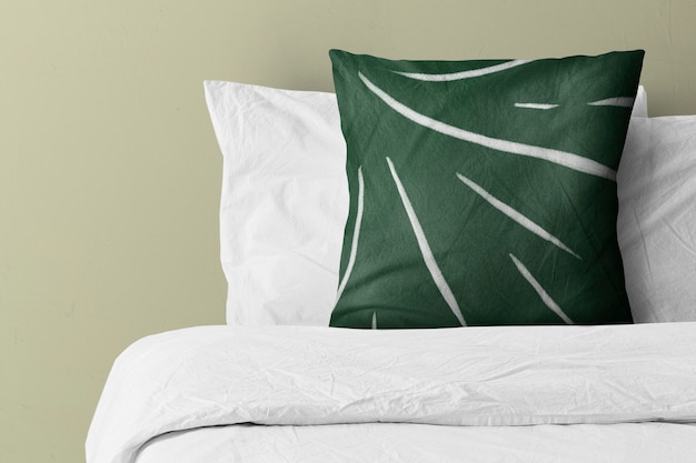 Free Photo pillow on bed with green pattern