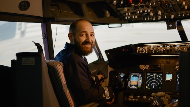 Free photo portrait of airplane captain preparing to fly aircraft in cockpit, using control panel dashboard with switch and buttons. aviator pilot flying plane with power command, navigation.