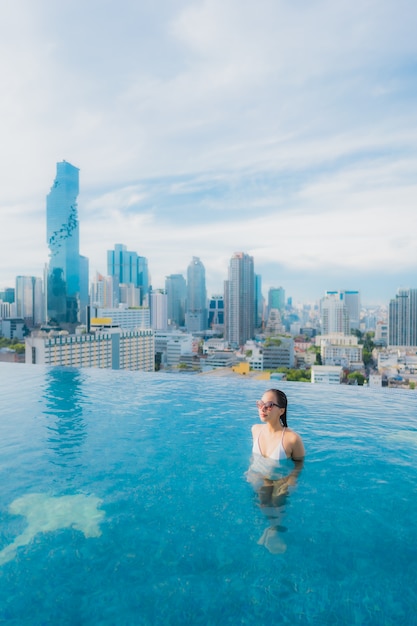 Free Photo portrait beautiful young asian woman relax happy smile leisure around outdoor swimming pool