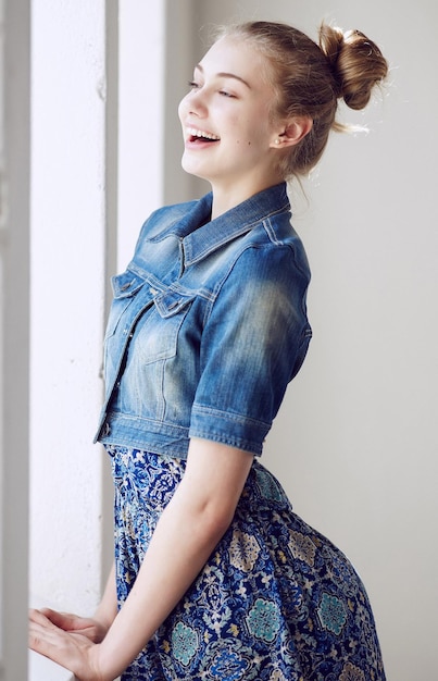 Free photo portrait of a blue eyed blond female dressed in a denim jacket.