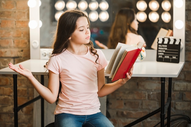 Free photo portrait of girl rehearsing in makeup room