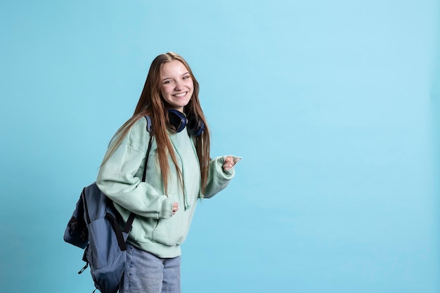 Free Photo portrait of radiant girl smiling while going to school