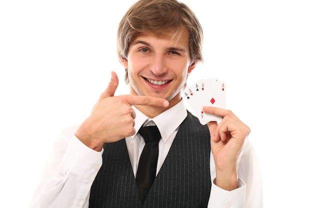 Free photo portrait of young man showing poker cards