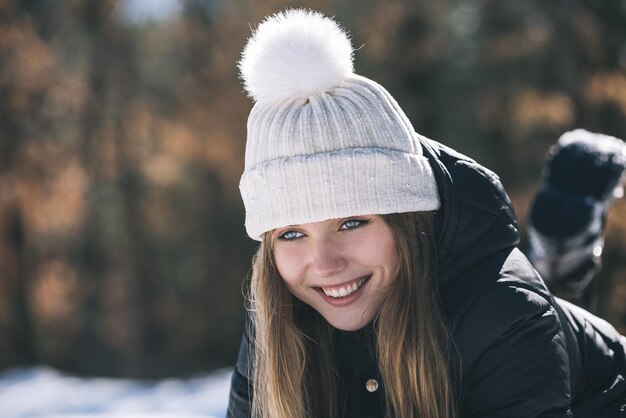 Portrait Young pretty woman in winter in the snow