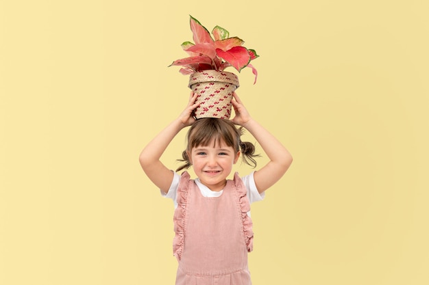 Free photo potted plants and kid studio shoot