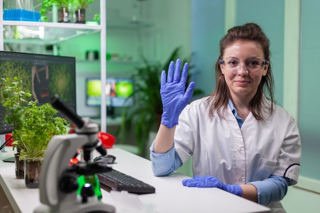 Free photo pov of chemist woman in white coat analyzing with biologists team