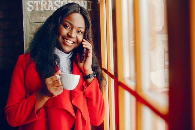 pretty black girl in a cafe