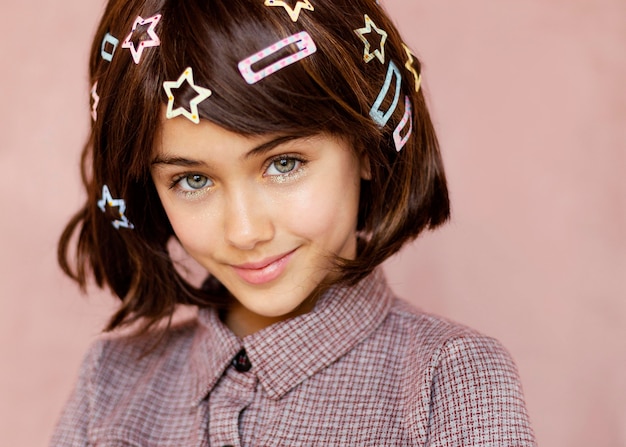 Free photo pretty girl with hair clips