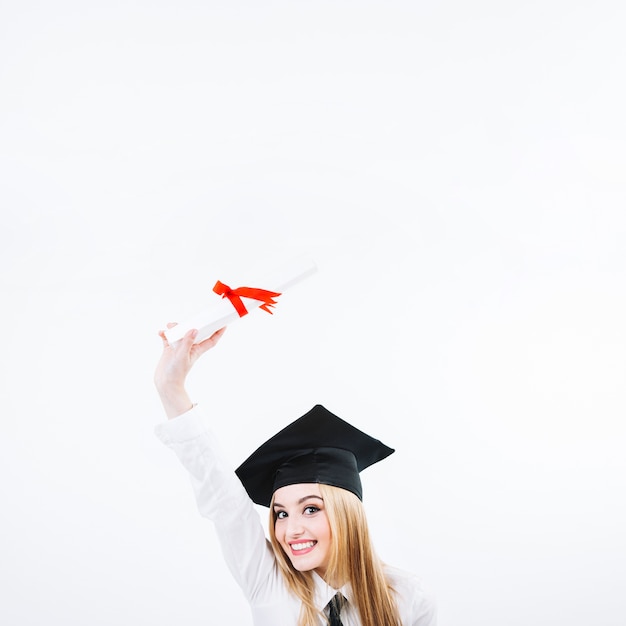 Pretty woman with graduation paper