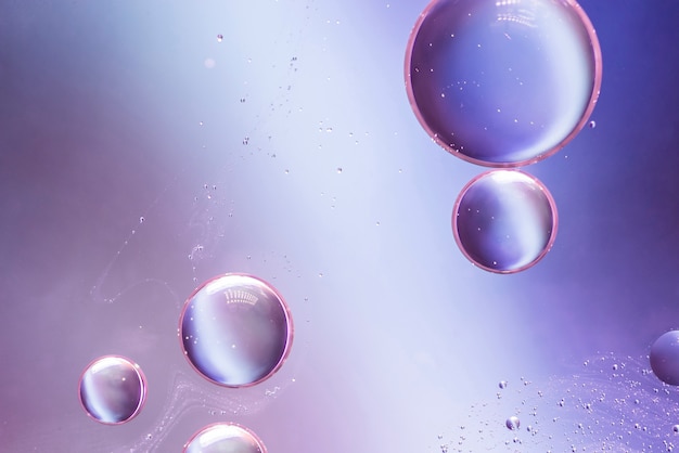 Free photo purple abstract background with bubbles