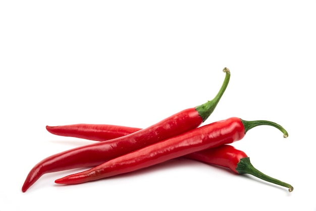 Free photo red fresh chili peppers isolated on white.
