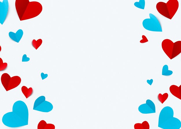 Romantic composition made with red hearts on white background with copyspace for text