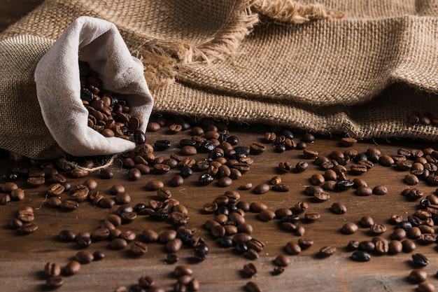 Free photo sack with coffee beans on table