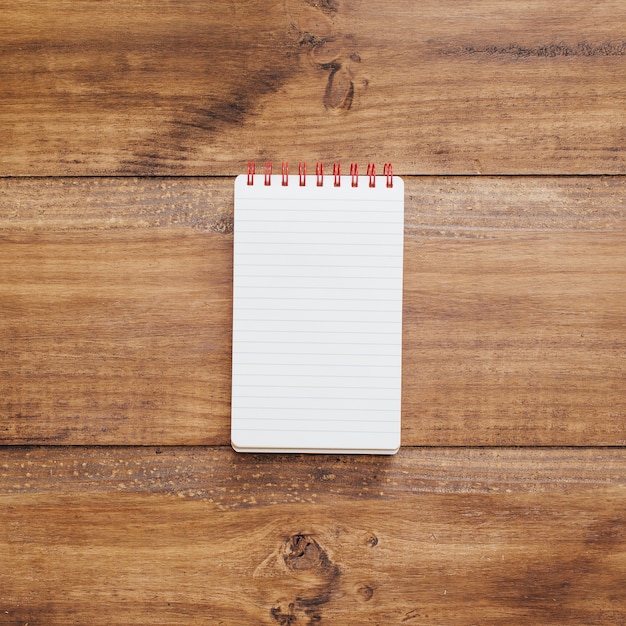 Free photo school notebook on a rustic wooden background