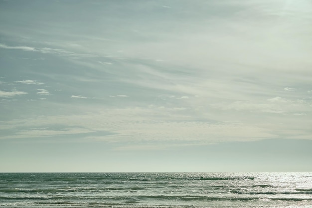 Free Photo sea on sunny cloudy sky background beautiful cloudy spring sky on a bright sunny day turquoise afternoon on the sandy beach of the black sea high quality photo