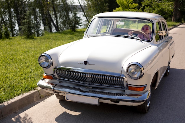 Senior woman traveling alone by car