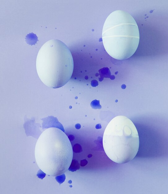 Set of Easter eggs between splashes of dye liquid