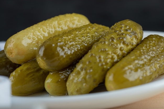 Free Photo set of marinated cucumbers on white plate